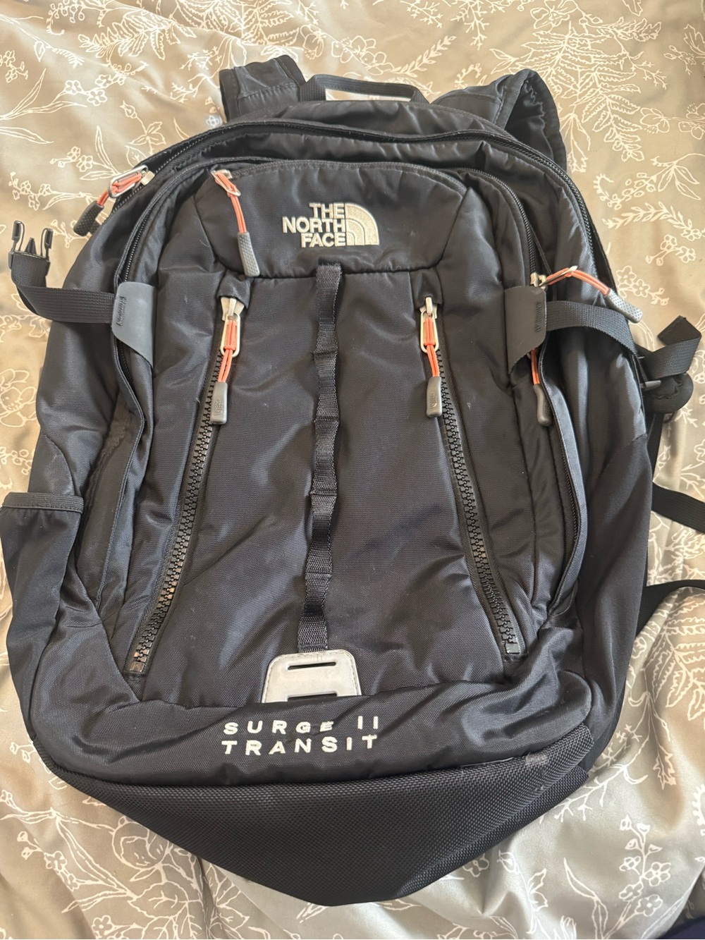 The North Face Black Surge II Transit Backpack with Orange Accents